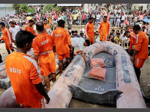 Rescuers of India’s National Disaster Response Force (NDRF) prepare their boats for rescue operation in Ganga River in Burdwan on Sunday after a boat capsized overnight in Kalna, Burdwan district, West Bengal on Saturday night. Rescuers of India’s National Disaster Response Force (NDRF) prepare their boats for rescue operation in Ganga River in Burdwan on Sunday after a boat capsized overnight in Kalna, Burdwan district, West Bengal on Saturday night.
