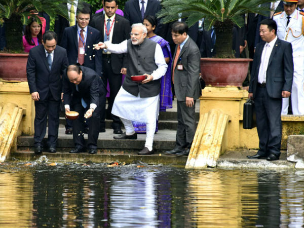 PM Modi feed fish in Uncle Ho's pond in Hanoi PM Modi feed fish in Uncle Ho's pond in Hanoi