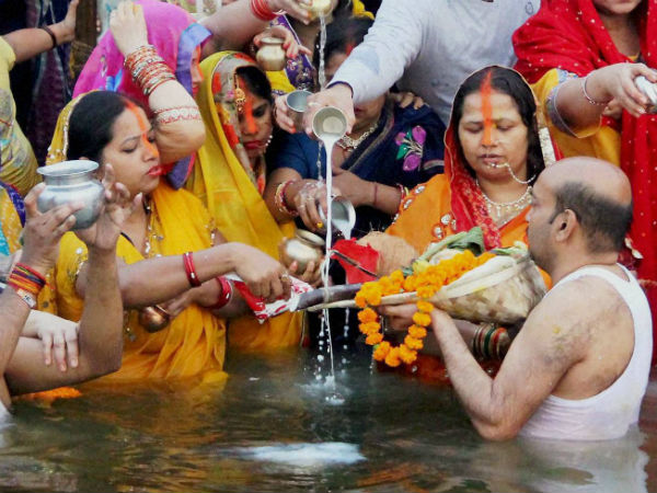 Hindu devotees offer prayers to the rising Sun in Allahabad