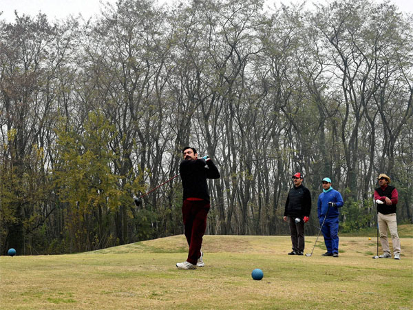 Golfers seen 'put'ting at Royal Spring Golf course