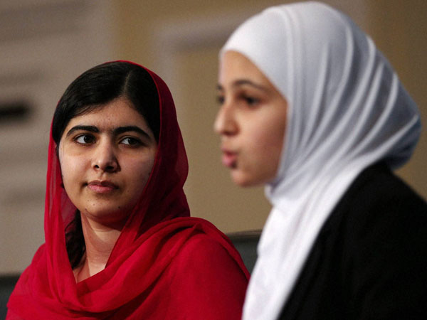 Nobel Peace Prize winner Malala Yousafzai, left, and 17-year-old Syrian refugee Mazoun Almellehan during a press conference during the 'Supporting Syria and the Region' conference at the Queen Elizabeth II Conference Centre in London. Nobel Peace Prize winner Malala Yousafzai, left, and 17-year-old Syrian refugee Mazoun Almellehan during a press conference during the 'Supporting Syria and the Region' conference at the Queen Elizabeth II Conference Centre in London.