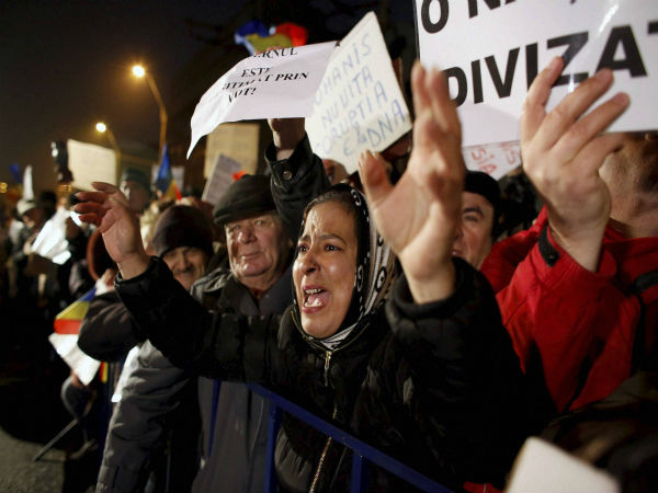 A woman shouts slogans during protest A woman shouts slogans during protest