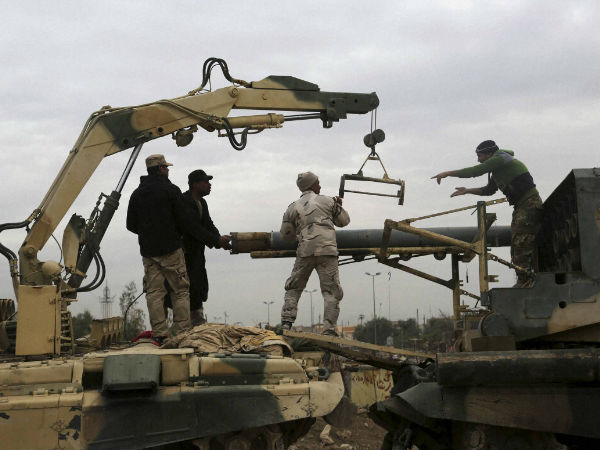 Iraqi Army soldiers load rockets into a multi-barrel rocket launcher during fight against Islamic State militants to regain control of Mosul Iraqi Army soldiers load rockets into a multi-barrel rocket launcher during fight against Islamic State militants to regain control of Mosul