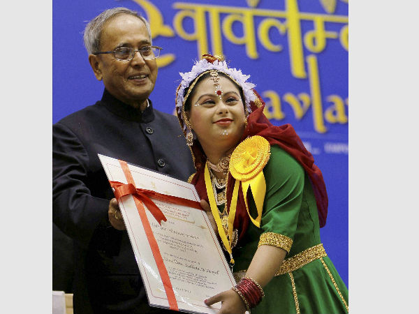 President Pranab Mukherjee presenting Role Model Mental Retardation/Mental Illness of Autism (Female) award to Rini Das of West Bengal during the National Awards for the Empowerment of Persons with Disabilities-2013 function in New Delhi. President Pranab Mukherjee presenting Role Model Mental Retardation/Mental Illness of Autism (Female) award to Rini Das of West Bengal during the National Awards for the Empowerment of Persons with Disabilities-2013 function in New Delhi.