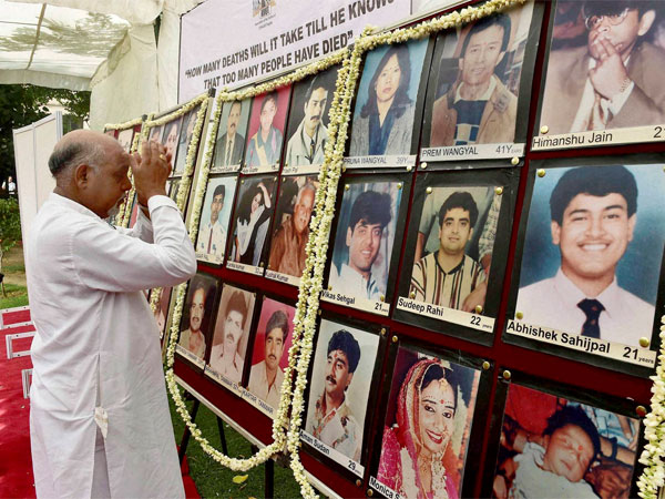 A man paying tribute to Uphaar tragedy victims on the 18th anniversary of the incident, in New Delhi. A man paying tribute to Uphaar tragedy victims on the 18th anniversary of the incident, in New Delhi.