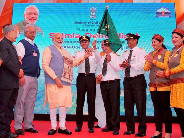 PM Narendra Modi launching the UDAN – Regional Connectivity Scheme for Civil Aviation - by flagging-off the first UDAN flight from Shimla. Union Minister for Civil Aviation, Ashok Gajapathi Raju Pusapati and Himachal Pradesh Chief Minister Virbhadra Singh are also seen. PM Narendra Modi launching the UDAN – Regional Connectivity Scheme for Civil Aviation - by flagging-off the first UDAN flight from Shimla. Union Minister for Civil Aviation, Ashok Gajapathi Raju Pusapati and Himachal Pradesh Chief Minister Virbhadra Singh are also seen.