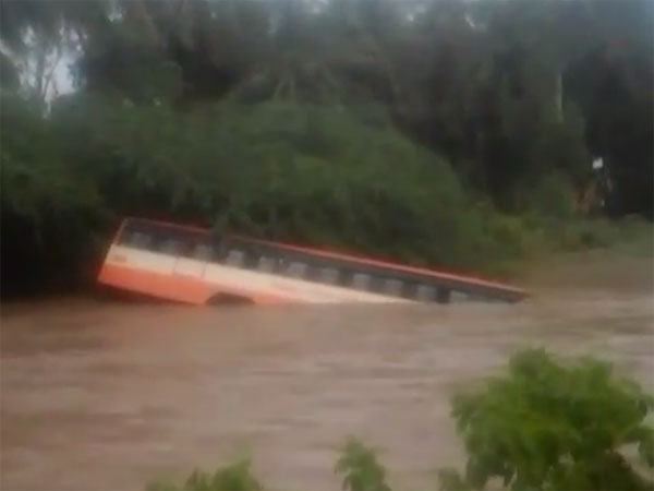 Bus swept away by gushing waters Bus swept away by gushing waters