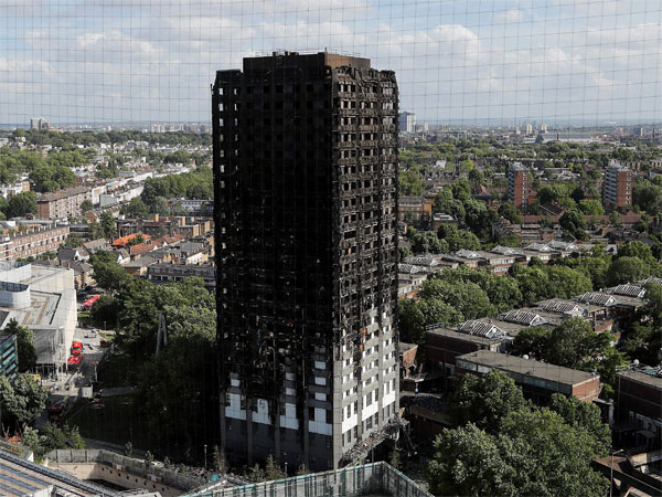 Massive fire engulfed a 24-storey residential tower housing over 100 families in west London on Wednesday Massive fire engulfed a 24-storey residential tower housing over 100 families in west London on Wednesday