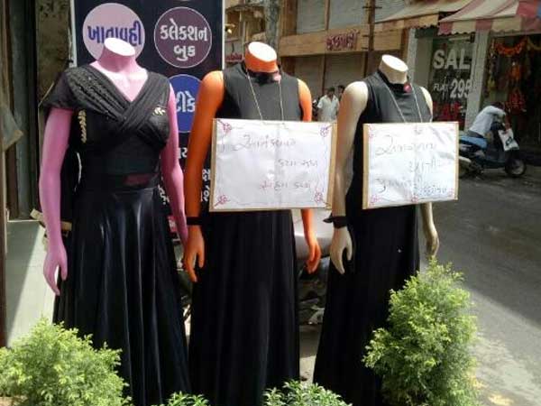 Placards on mannequins condemning attack