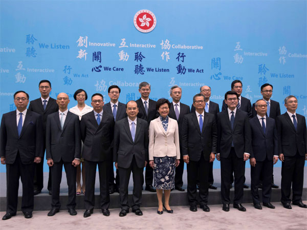Hong Kong Chief Executive Lam Cheng, (center), lines up with her new members of cabinet during a news conference in Hong Kong. PTI Hong Kong Chief Executive Lam Cheng, (center), lines up with her new members of cabinet during a news conference in Hong Kong. PTI