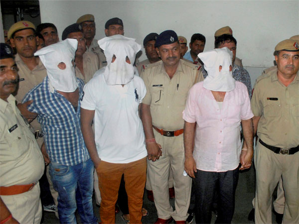 Police produce the three of four men, accused in Junaid Khan lynching case, in the District Court in Faridabad on Thursday. PTI Photo Police produce the three of four men, accused in Junaid Khan lynching case, in the District Court in Faridabad on Thursday. PTI Photo
