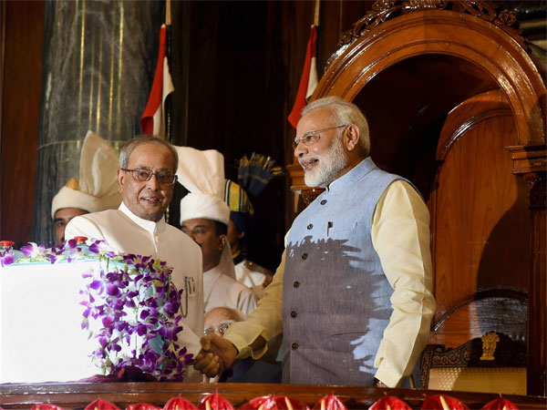 President Pranab Mukherjee and Prime Minister Narendra Modi shake hands after the launch of 'Goods and Services Tax (GST)', at the special ceremony in the Central Hall of Parliament in New Delhi President Pranab Mukherjee and Prime Minister Narendra Modi shake hands after the launch of 'Goods and Services Tax (GST)', at the special ceremony in the Central Hall of Parliament in New Delhi