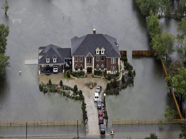 Houston: A home is surrounded by floodwaters from Tropical Storm Harvey on Tuesday (Image courtesy - PTI) Houston: A home is surrounded by floodwaters from Tropical Storm Harvey on Tuesday (Image courtesy - PTI)