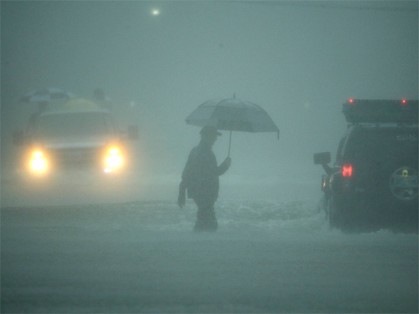 A man walks through floodwaters from Tropical Storm Harvey as he evacuates his home on Sunday, Aug. 27, 2017, in Houston, Texas. AP/PTI photo A man walks through floodwaters from Tropical Storm Harvey as he evacuates his home on Sunday, Aug. 27, 2017, in Houston, Texas. AP/PTI photo