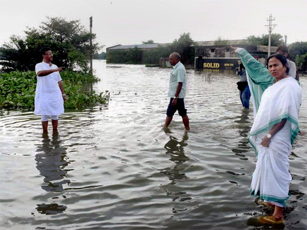 West Bengal Chief Minister Mamata Banerjee inspects a flood-hit region in Malda district. PTI file photo West Bengal Chief Minister Mamata Banerjee inspects a flood-hit region in Malda district. PTI file photo
