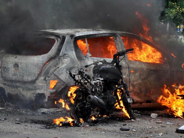 Dera followers set private vehicle ablaze aftermath of Ram Rahim verdict. Photo credit: PTI Dera followers set private vehicle ablaze aftermath of Ram Rahim verdict. Photo credit: PTI