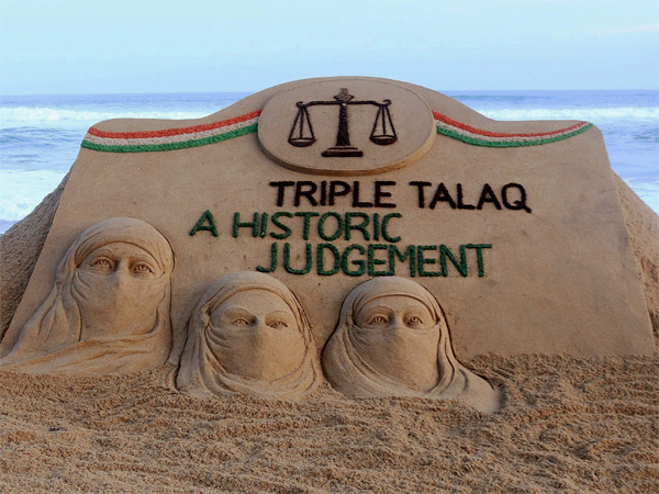 Sand artist Sudarsan Pattnaik creates a sand sculpture with the message "Triple Talaq A Historic Judgement" at Puri beach of Odisha on Tuesday. PTI Photo Sand artist Sudarsan Pattnaik creates a sand sculpture with the message "Triple Talaq A Historic Judgement" at Puri beach of Odisha on Tuesday. PTI Photo