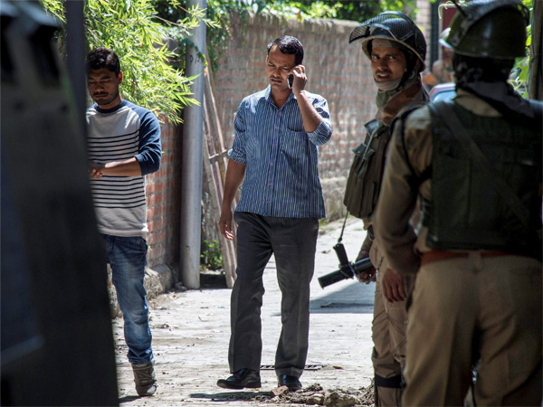 IA officials at a house during a raid in Srinagar on Thursday. NIA today carried out searches at 10 places in Jammu and Kashmir and the NCR in connection with its probe into the funding of terror activities in the Kashmir Valley. IA officials at a house during a raid in Srinagar on Thursday. NIA today carried out searches at 10 places in Jammu and Kashmir and the NCR in connection with its probe into the funding of terror activities in the Kashmir Valley.