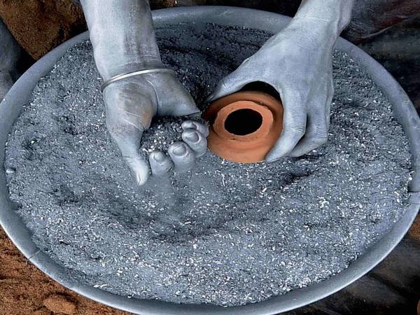 Worker's hands soaked in gun powder