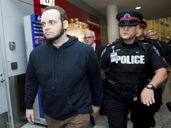 Joshua Boyle, left, gets a police escort after speaking to the media after arriving at the airport in Toronto on Friday, Oct. 13, 2017. Boyle, his wife Caitlin Coleman, and their three children landed in Canada after they were kidnapped in Afghanistan while on a backpacking trip and held hostage for five years by the Taliban-linked Haqqani network. PTI file photo Joshua Boyle, left, gets a police escort after speaking to the media after arriving at the airport in Toronto on Friday, Oct. 13, 2017. Boyle, his wife Caitlin Coleman, and their three children landed in Canada after they were kidnapped in Afghanistan while on a backpacking trip and held hostage for five years by the Taliban-linked Haqqani network. PTI file photo