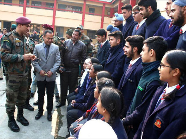 Dhoni interacts with school children Dhoni interacts with school children
