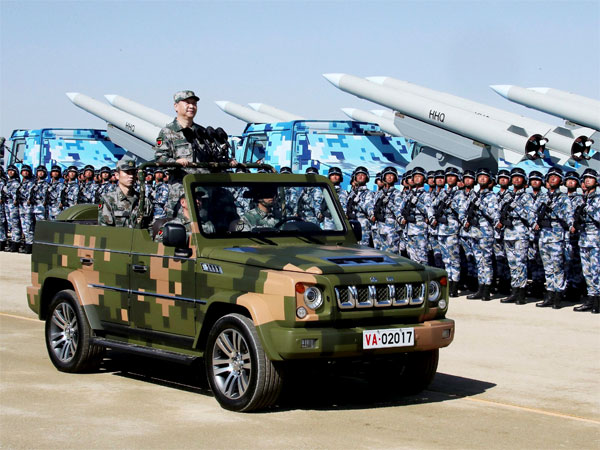 Chinese President Xi Jinping stands on a military jeep as he inspects troops of the People's Liberation Army during a military parade Chinese President Xi Jinping stands on a military jeep as he inspects troops of the People's Liberation Army during a military parade