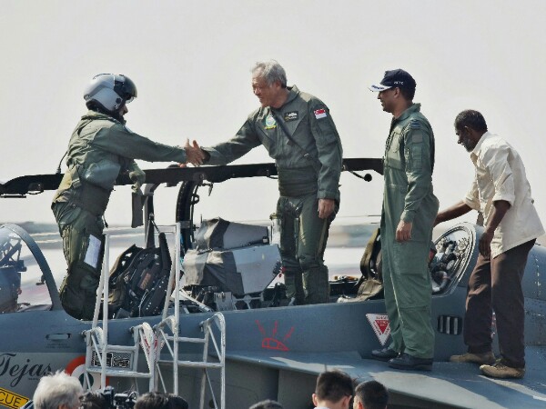 Defence Minister of Singapore, Ng Eng Hen, after a sortie in the trainer version of the Light Combat Aircraft Defence Minister of Singapore, Ng Eng Hen, after a sortie in the trainer version of the Light Combat Aircraft