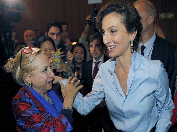 UNESCO'S new elected director-general France's Audrey Azoulay,right, is congratulated by an employee as she arrives at the council hall at the UNESCO headquarters in Paris, France. PTI file photo UNESCO'S new elected director-general France's Audrey Azoulay,right, is congratulated by an employee as she arrives at the council hall at the UNESCO headquarters in Paris, France. PTI file photo