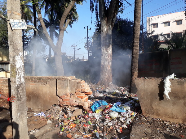 Garbage being burnt in the open near Banashankari bus stand