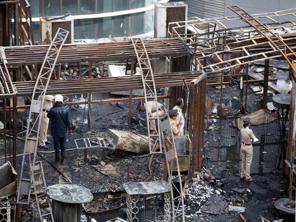 A team of policemen inspecting the fire site