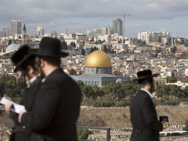 The Dome of the Rock Mosque in the Al Aqsa Mosque compound in Jerusalem's Old City is seen while Jewish orthodox men pray in a cemetery in Jerusalem. PTI file photo The Dome of the Rock Mosque in the Al Aqsa Mosque compound in Jerusalem's Old City is seen while Jewish orthodox men pray in a cemetery in Jerusalem. PTI file photo