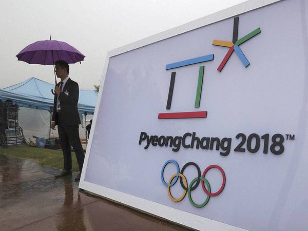 Security personnel stands by a logo of the 2018 PyeongChang Olympic Winter Games before an event to mark the start of the 500-day countdown in Seoul, South Korea. PTI file photo Security personnel stands by a logo of the 2018 PyeongChang Olympic Winter Games before an event to mark the start of the 500-day countdown in Seoul, South Korea. PTI file photo