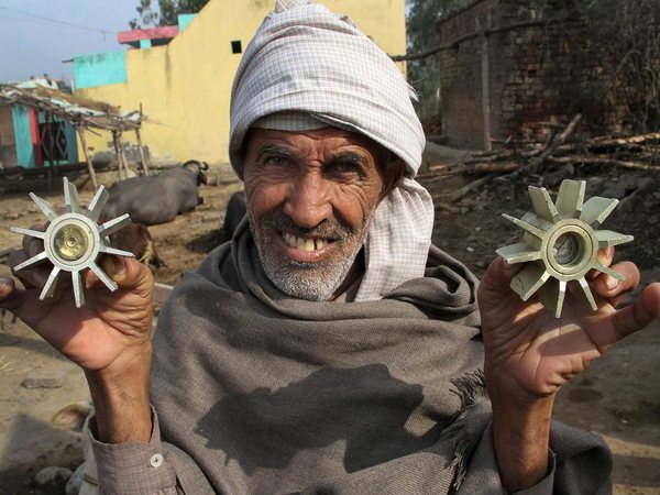 A villager displays a mortar shell allegedly fired on a residential area from the Pakistan side at the India-Pakistan international border at Pindi Camp in Arnia Sector about 40km from Jammu on Thursday. PTI Photo A villager displays a mortar shell allegedly fired on a residential area from the Pakistan side at the India-Pakistan international border at Pindi Camp in Arnia Sector about 40km from Jammu on Thursday. PTI Photo