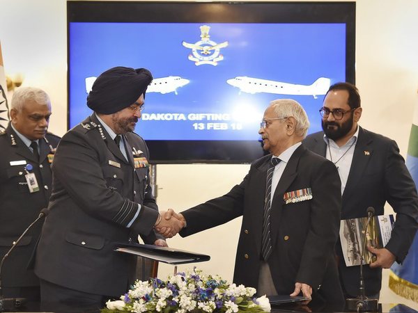 Air Chief Marshal B S Dhanoa shakes hands with Air Commodore (retd) M K Chandrasekhar, as Rajya Sabha MP Rajeev Chandrasekhar looks on during a function to mark ceremonial gifting of the Douglas DC3 Dakota to IAF, in New Delhi on Tuesday. PTI Photo Air Chief Marshal B S Dhanoa shakes hands with Air Commodore (retd) M K Chandrasekhar, as Rajya Sabha MP Rajeev Chandrasekhar looks on during a function to mark ceremonial gifting of the Douglas DC3 Dakota to IAF, in New Delhi on Tuesday. PTI Photo