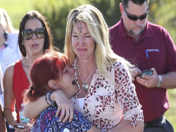 Parents wait for news after a reports of a shooting at Marjory Stoneman Douglas High School in Parkland, Fla., on Wednesday, Feb. 14, 2018. AP/PTI Parents wait for news after a reports of a shooting at Marjory Stoneman Douglas High School in Parkland, Fla., on Wednesday, Feb. 14, 2018. AP/PTI