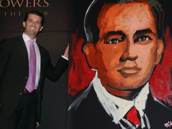 Donald Trump Jr. poses with his portrait. PTI file photo Donald Trump Jr. poses with his portrait. PTI file photo