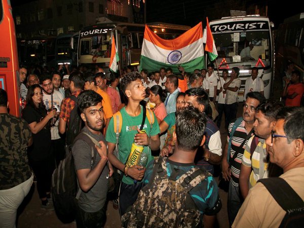 Devotees board buses in Jammu