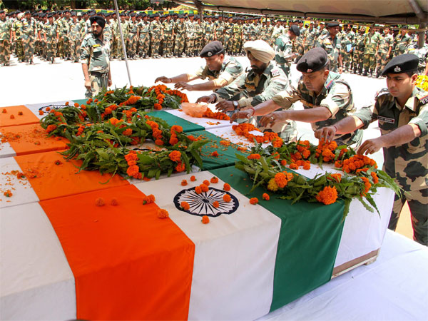 BSF jawans pay tribute to four of their colleagues, killed in Pakistani firing, at a wreath laying ceremony at Paloura BSF Headquarters in Jammu BSF jawans pay tribute to four of their colleagues, killed in Pakistani firing, at a wreath laying ceremony at Paloura BSF Headquarters in Jammu