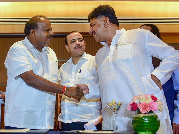 Karnataka Chief Minister H D Kumaraswamy shakes hands with Congress leader D K Shivakumar Karnataka Chief Minister H D Kumaraswamy shakes hands with Congress leader D K Shivakumar