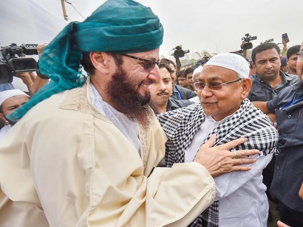 Nitish Kumar hugs a muslim devotee