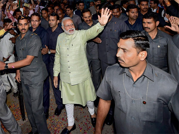 Prime Minister Narendra Modi, surrounded by security personnel Prime Minister Narendra Modi, surrounded by security personnel