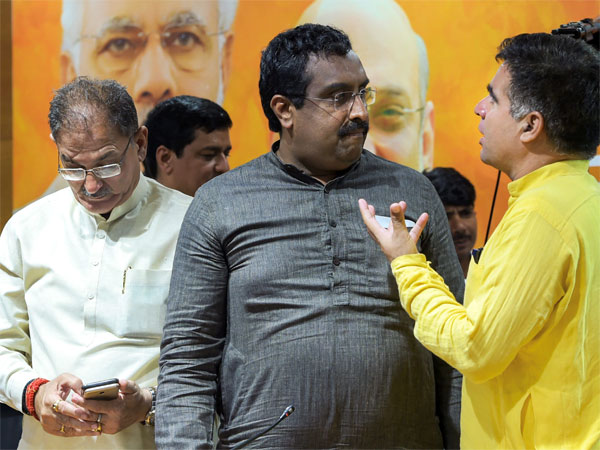 Bharatiya Janata Party (BJP) in-charge for Jammu and Kashmir Ram Madhav with the state Dy Chief Minister Kavinder Gupta (L) and BJP state chief Ravinder Raina Bharatiya Janata Party (BJP) in-charge for Jammu and Kashmir Ram Madhav with the state Dy Chief Minister Kavinder Gupta (L) and BJP state chief Ravinder Raina