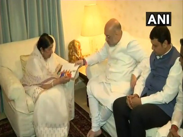 Amit Shah meets Lata Mangeshkar (Image courtesy - ANI/Twitter) Amit Shah meets Lata Mangeshkar (Image courtesy - ANI/Twitter)