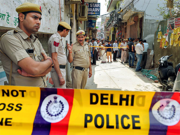 Police personnel guard near the house, where 11 members of a family- four men, three women and four girls- were found hanging from an iron grill, in Burari area of New Delhi Police personnel guard near the house, where 11 members of a family- four men, three women and four girls- were found hanging from an iron grill, in Burari area of New Delhi