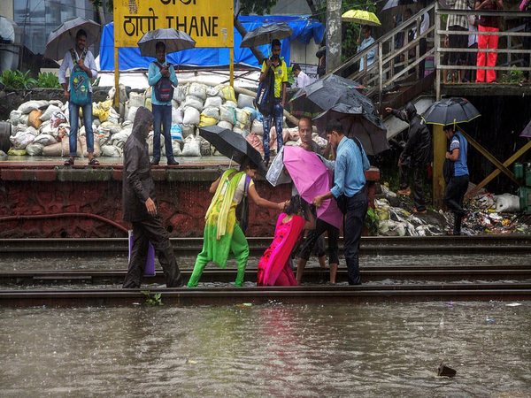 Trains, buses run with delay as Mumbai battles heavy rains