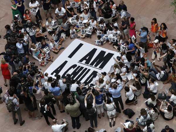 Families with young children protest the separation of immigrant families with a sit-in at the Hart Senate Office Building, Thursday, July 26, 2018, on Capitol Hill in Washington. The Trump administration faces a court-imposed deadline Thursday to reunite thousands of children and parents who were forcibly separated at the U.S.-Mexico border, an enormous logistical task brought on by its zero tolerance policy on illegal entry. AP/PTI photo Families with young children protest the separation of immigrant families with a sit-in at the Hart Senate Office Building, Thursday, July 26, 2018, on Capitol Hill in Washington. The Trump administration faces a court-imposed deadline Thursday to reunite thousands of children and parents who were forcibly separated at the U.S.-Mexico border, an enormous logistical task brought on by its zero tolerance policy on illegal entry. AP/PTI photo