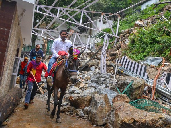 Devotees ride on mules