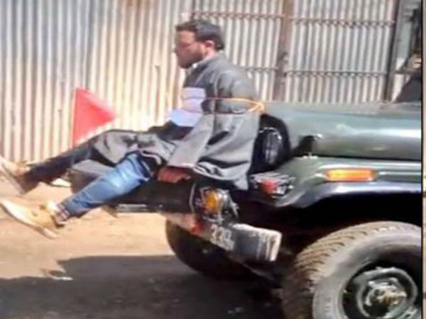 File photo of Farooq Ahmad Dar tied to an army jeep File photo of Farooq Ahmad Dar tied to an army jeep