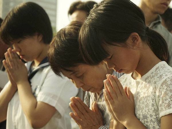 Visitors pray for the atomic bomb victims in front of the cenotaph at the Hiroshima Peace Memorial Park in Hiroshima. PTI file photo Visitors pray for the atomic bomb victims in front of the cenotaph at the Hiroshima Peace Memorial Park in Hiroshima. PTI file photo