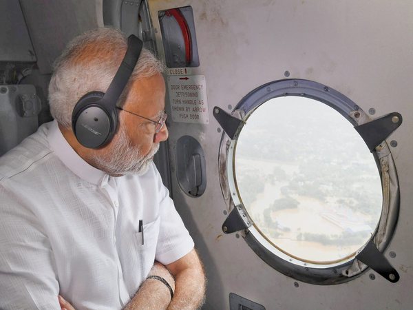 PM Modi takes aerial survey of flood-hit Kerala. Photo credit: PTI PM Modi takes aerial survey of flood-hit Kerala. Photo credit: PTI
